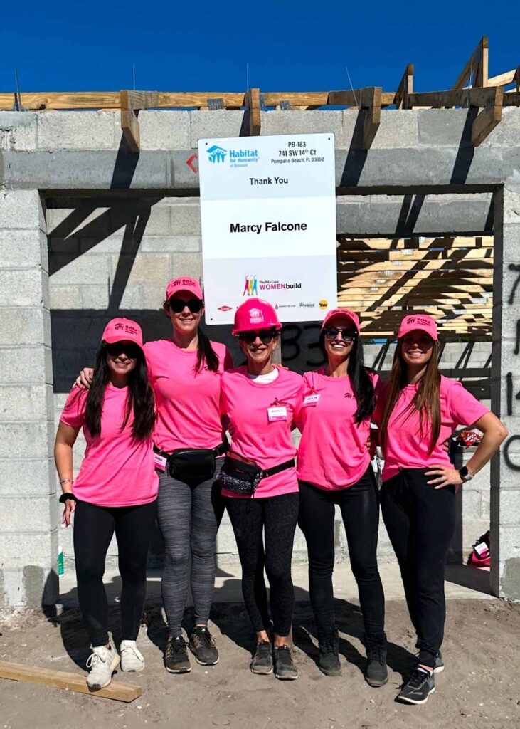 Marcy Falcone and daughters-in-law Anna, Ashley, Jaclyn, and Lauren Munoz, at the Habitat for Humanity village.